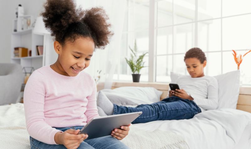 Digital Awareness – parent guiding a child on safe device use