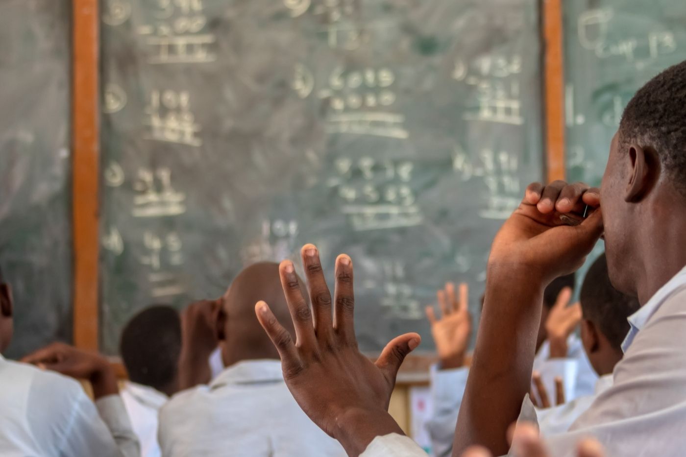Learner raising a hand during a guided study session