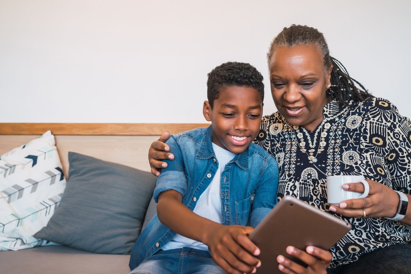 Parents reviewing screen time habits and family tech agreements